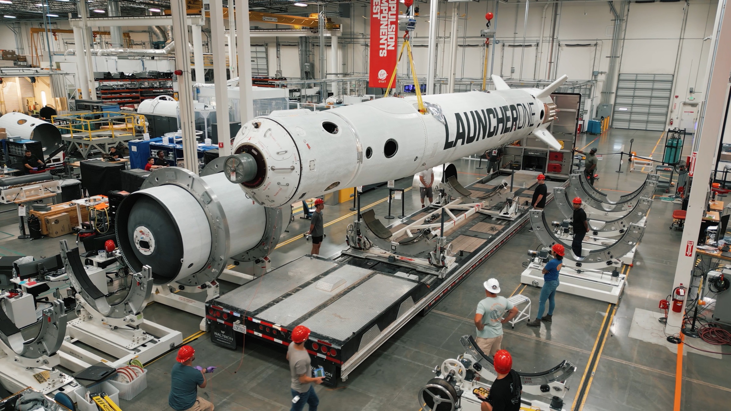 Drone view of the Virgin Orbit factory floor with LauncherOne manufacturing and engineering activity.