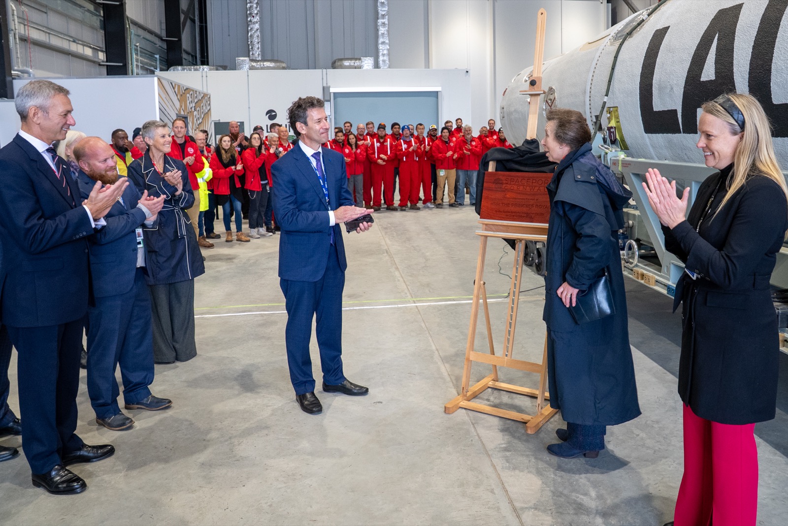 CEO and Princess Anne during a leadership event beside LauncherOne.