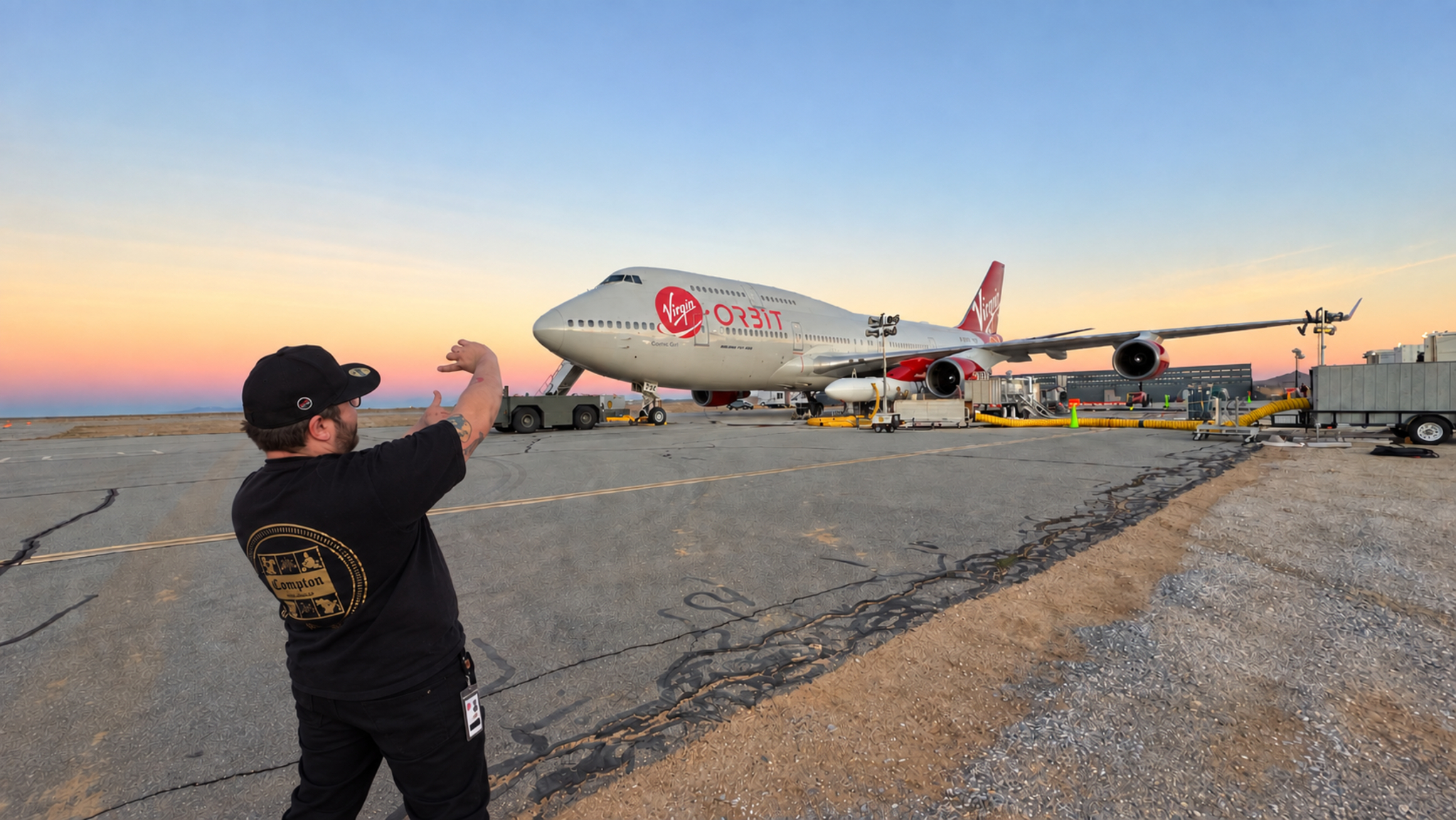 Daniel Jarvis framing a shot of Virgin Orbit’s Cosmic Girl at sunset.